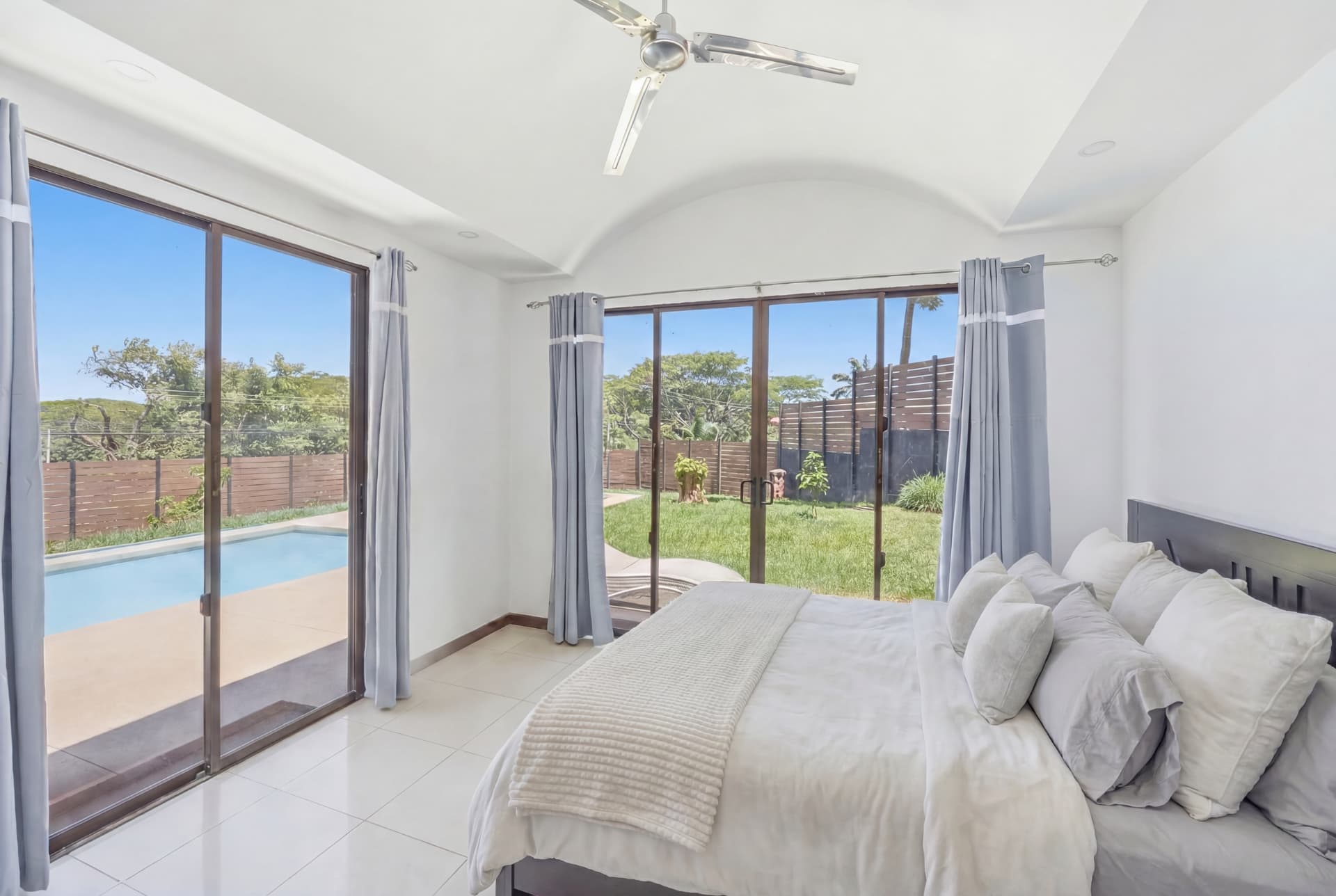 En suite bedroom opening onto the private pool