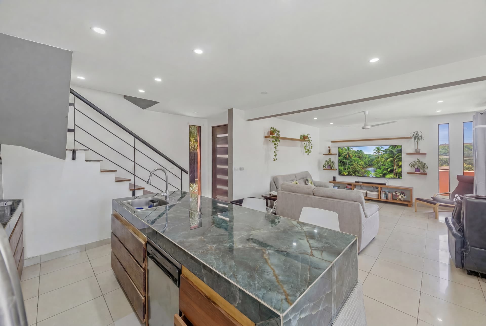 Open plan kitchen and living room in the Tamarindo vacation rental